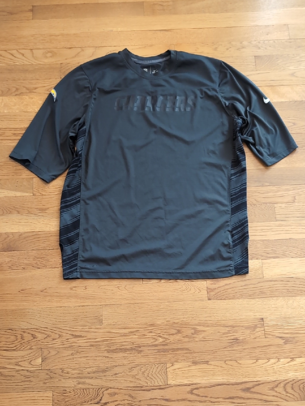 Nike Black Short-Sleeve Performance Tee with Tonal Stripe Panels Charger's NFL